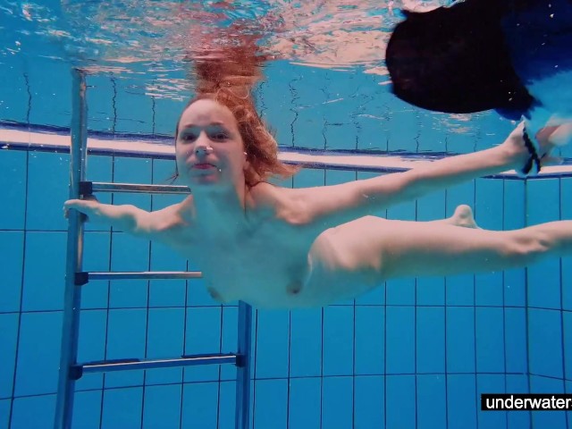Teen Girl Avenna Is Swimming In The Pool