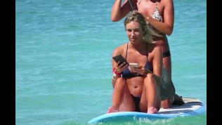 Accidental nudity of hot surfer girl on the beach