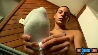 Jessie masturbates and covers his twink feet with fresh cum